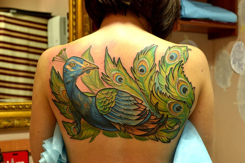 Татуировка павлин на спине